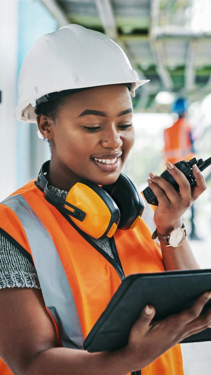 Engineer reviewing building systems on a tablet