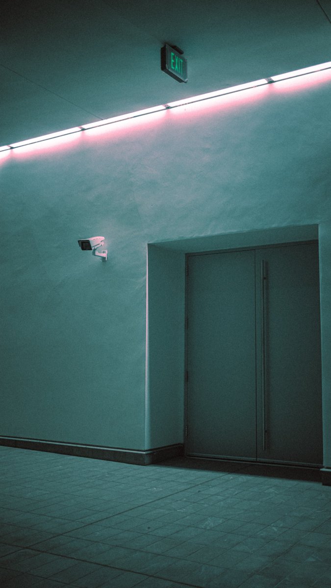Modern building interior with elevator access and integrated lighting